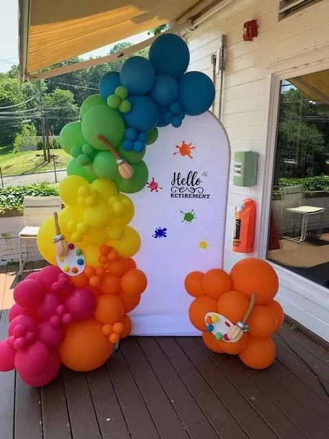 Rainbow garland welcome backdrop